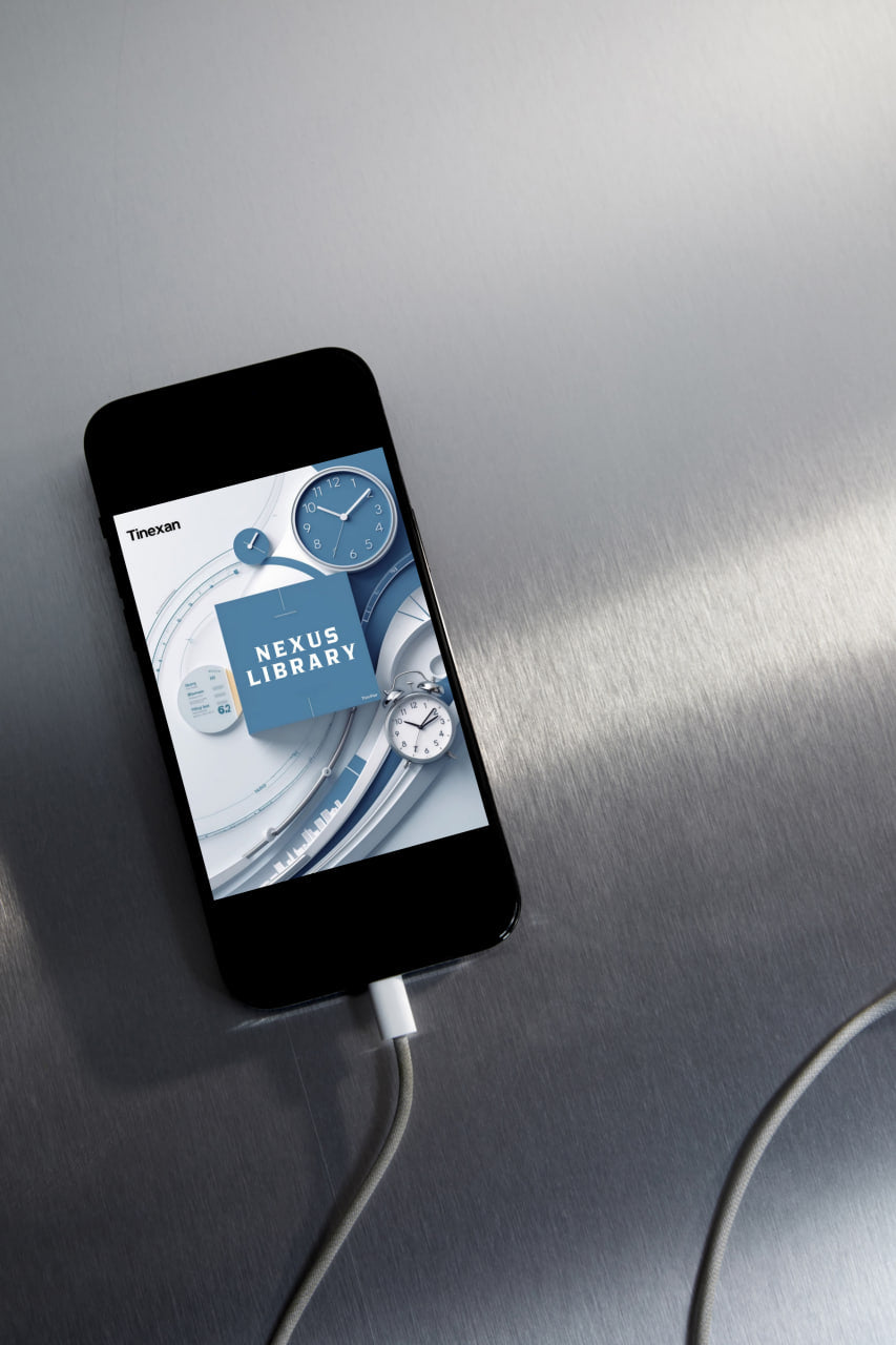 Smartphone with a digital clock app on a metallic surface